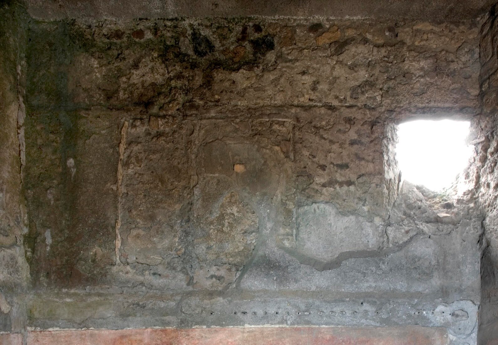 E wall, upper zone with window.